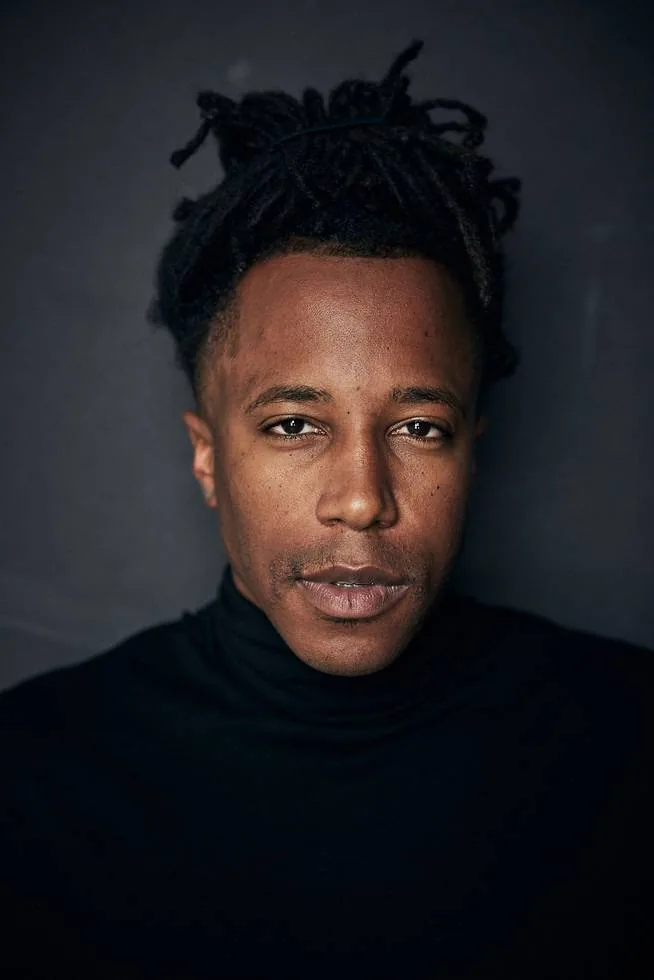 Chad Chambers headshot wearing a black turtleneck
