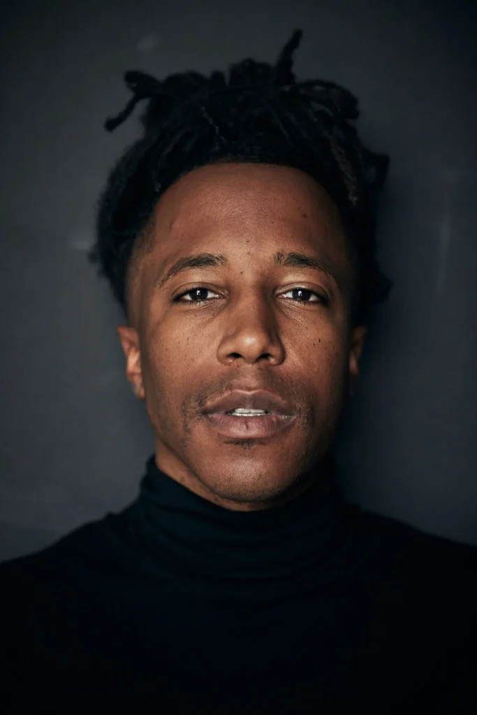 Close-up portrait of Chad Chambers in a black turtleneck