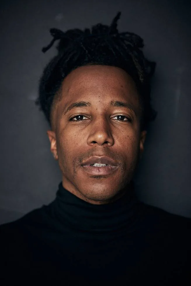 Chad Chambers editorial headshot in a black turtleneck