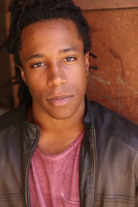 Chad Chambers wearing a leather jacket in a close-up portrait