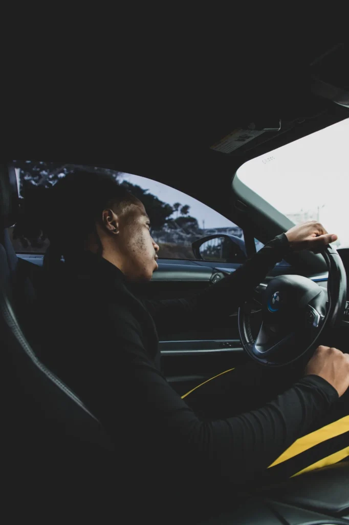 Chad Chambers seated at the wheel of a BMW