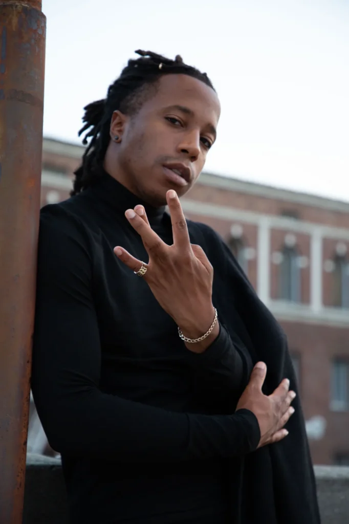 Chad Chambers wearing a black turtleneck in an outdoor portrait