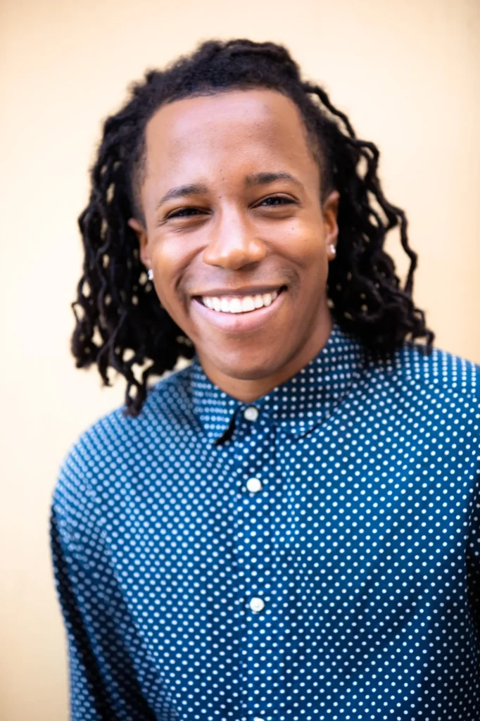 Chad Chambers smiling in a blue patterned shirt