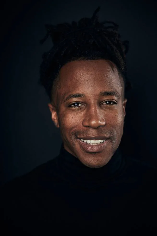 Chad Chambers smiling in a black turtleneck